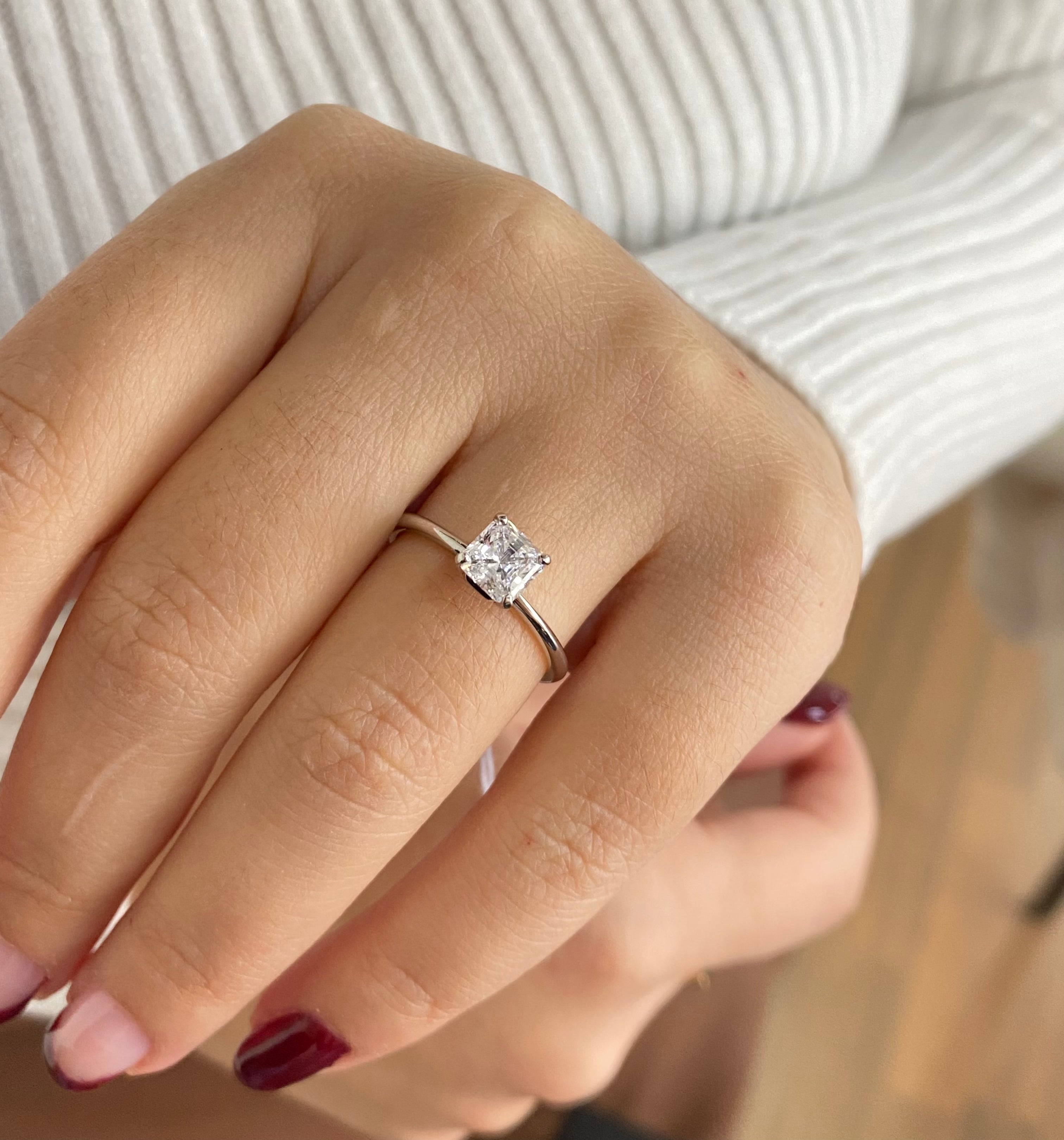 Sparkling square solitaire ring