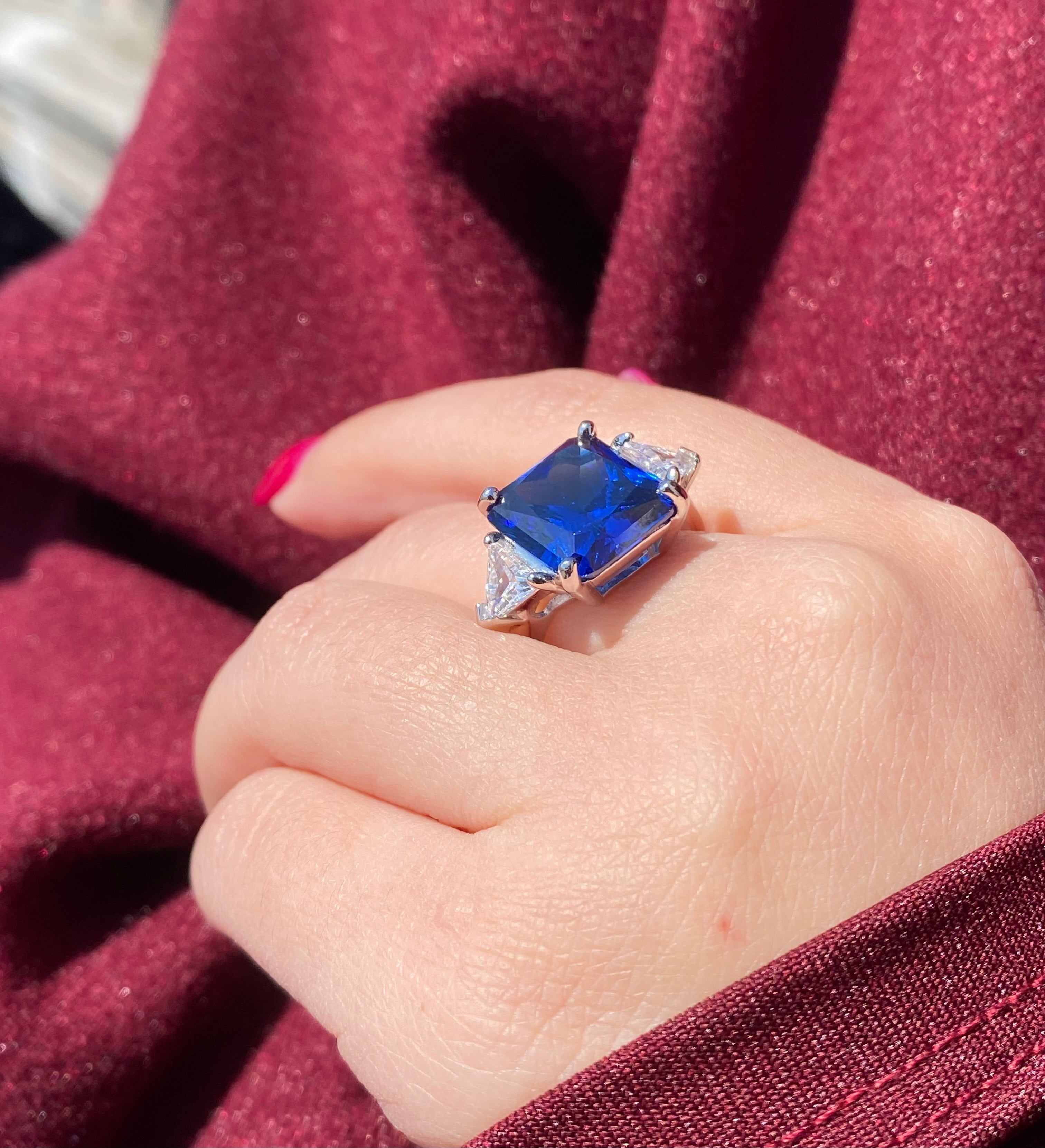 Synthetic sapphire ring with luminous triangles