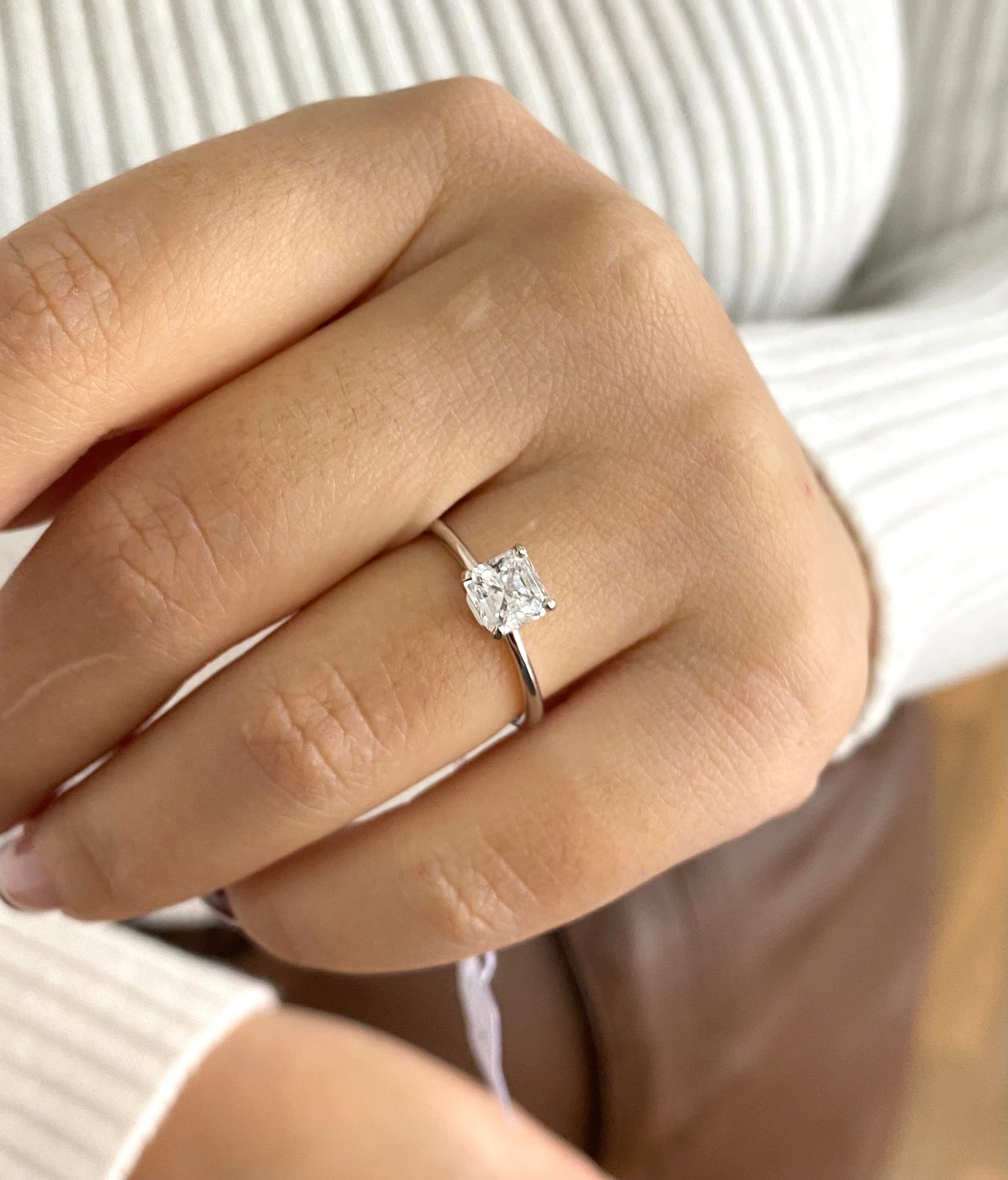 Sparkling square solitaire ring